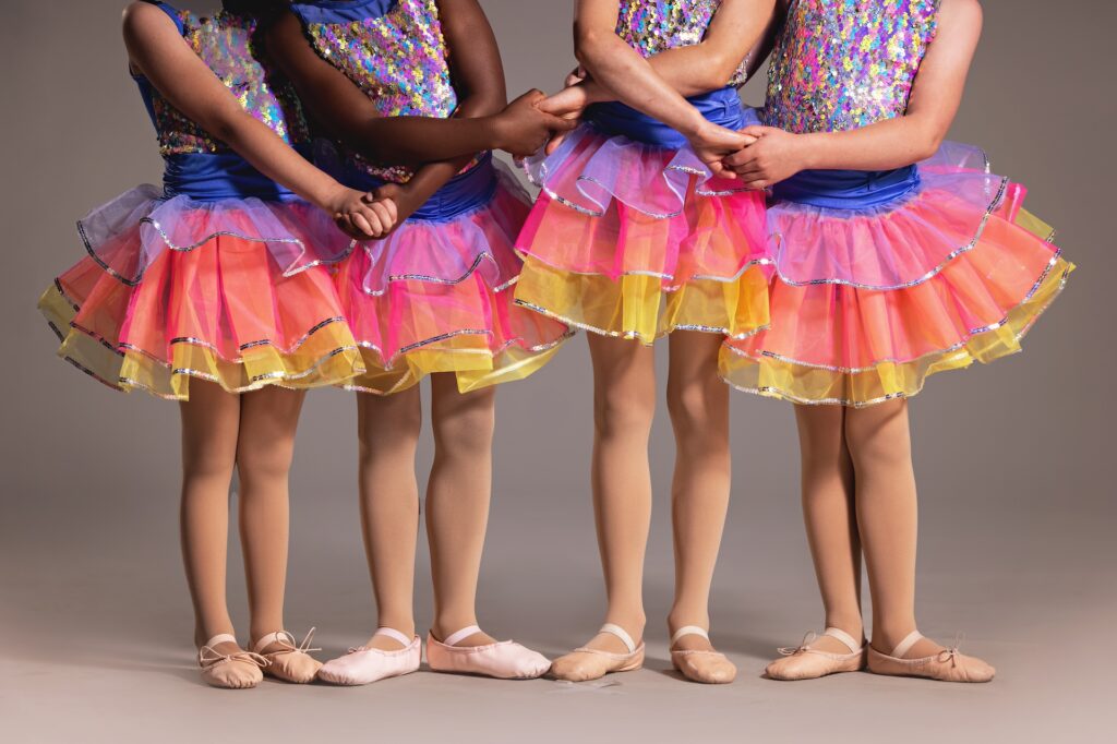Dancers in colorful recital costumes